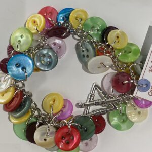 White luxury SUV parked on cobblestone street at night