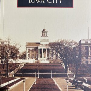 Woman in white coat holding smartphone outdoors