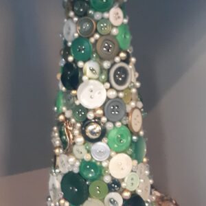 Person holding smartphone displaying colorful mobile app interface