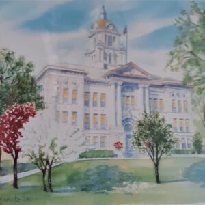 Woman in yellow dress dancing joyfully outdoors