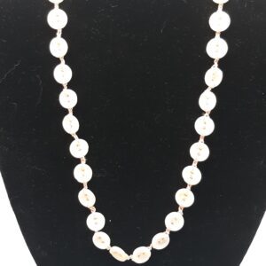 Golden retriever dog sitting on colorful woven rug