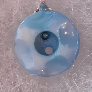 Golden retriever puppy lying on wooden floor indoors