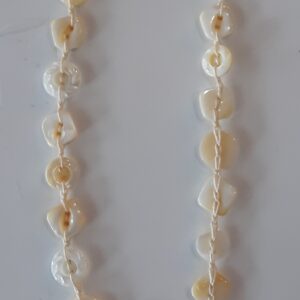 Person in black hoodie using smartphone outdoors