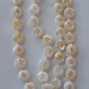 Golden retriever dog sitting in green grass field