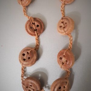 Woman in hijab typing on laptop computer