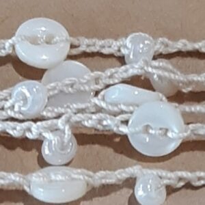 Elderly man reading newspaper in comfortable armchair