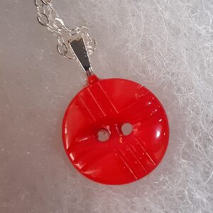 Wooden cutting board with sliced vegetables and herbs