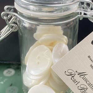 Modern kitchen with white cabinets and marble countertops