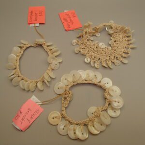 Person holding smartphone displaying colorful mobile app interface