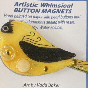 Woman in red coat walking on snowy forest path